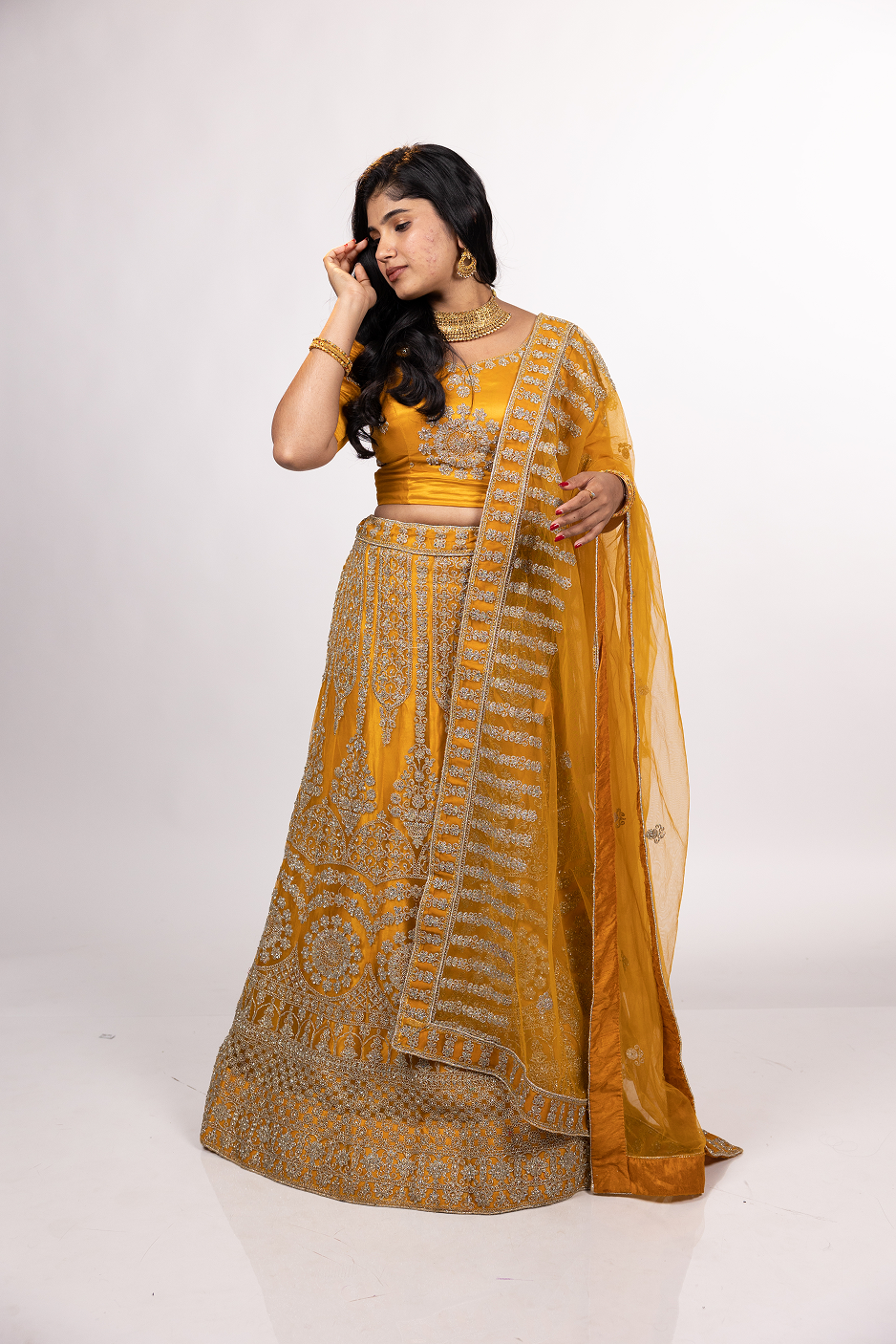 Elegant beige lehenga with golden embellishments